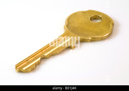 Simple single Yale type key on a white background Stock Photo