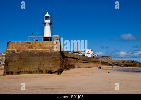 The lighthouse on Smeaton's Pier in a sunny St Ives, Cornwall. Stock Photo