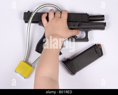 Black handgun with gun lock Stock Photo