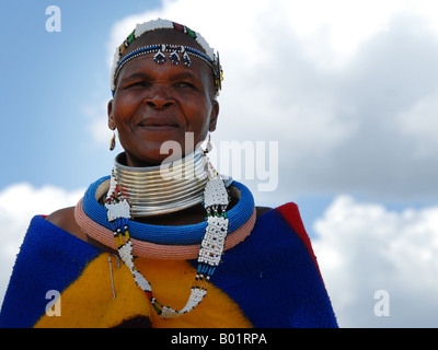 Ndebele woman in her traditional clothing in the museum village of Botshabelo in South Africa near Middelburg. Stock Photo