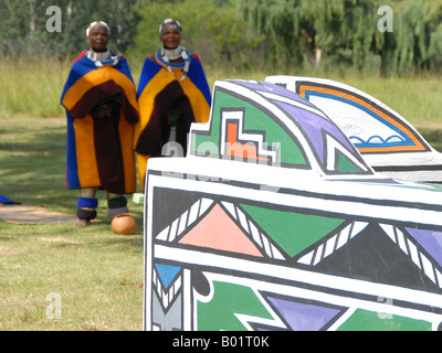 Two Ndebele woman in their traditional clothing in the museum village of Botshabelo in South Africa near Middelburg. Stock Photo