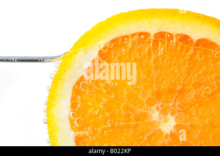 Orange slice in water on white background Stock Photo