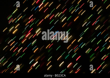 Abstract background of multi-colored streaked Christmas lights. Stock Photo