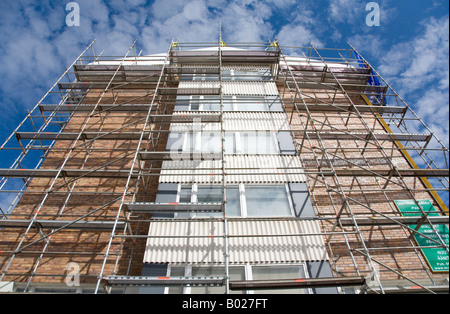 Professional scaffolding at block of flats facade being renovated at Oulu , Finland Stock Photo