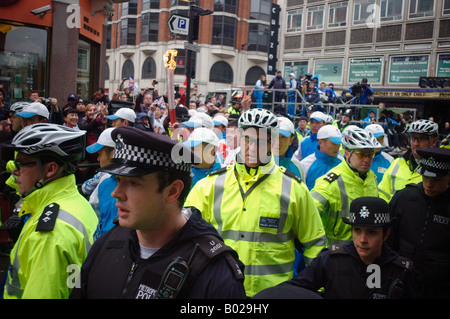 Police protecting the Olympic Torch from Pro Tibetan Demonstrators in China Town London Stock Photo