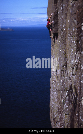 Ricky Bell climbing on the Rathlin Wall at Fairhead Stock Photo