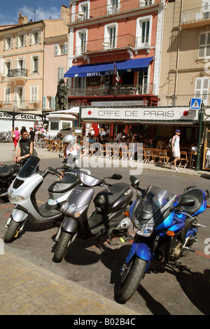 Scooters parked on the quayside outside the Cafe de Paris, St. Tropez, Provence, France Stock Photo
