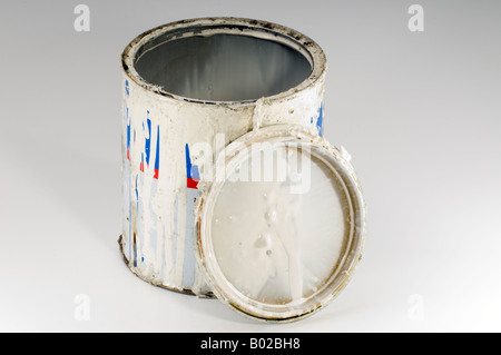 Old opened tin of white gloss paint Stock Photo