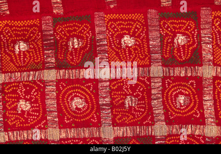 India Gujerat Crafts Gharchola pattern fabric gold woven houses and animal shapes with tie dye pattern Stock Photo