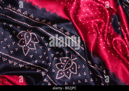 India Gujerat Crafts antique red and black tie dyed silk sari with Paln border from Jamnagar Stock Photo