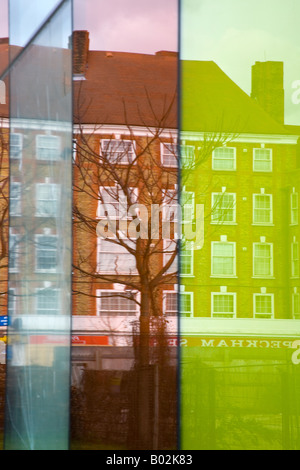reflections of houses on Peckham High Street in Coloured Windows of Peckham Library Peckham London England March 2008 Stock Photo