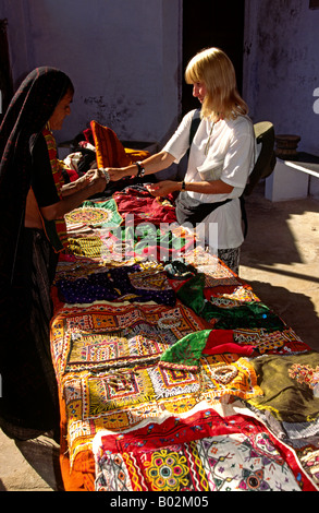 India Gujerat Bhuj western visitor at tribal craft stall Stock Photo