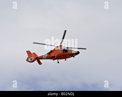 US Coast Guard Helicopter patrol over Mississippi River at New Orleans Stock Photo