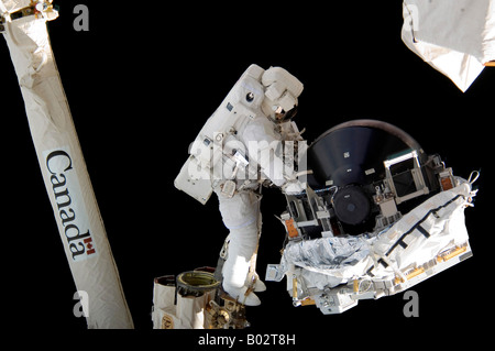 Astronaut partcipating in extravehicular activity. Stock Photo