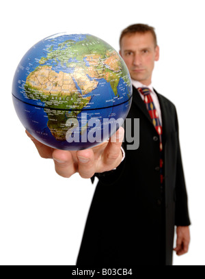 Businessman holding a globe Stock Photo