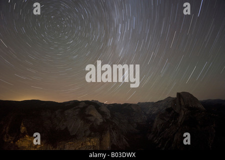 Stunning star trails over Half Dome and Yosemite Valley in Yosemite National Park, California, USA Stock Photo
