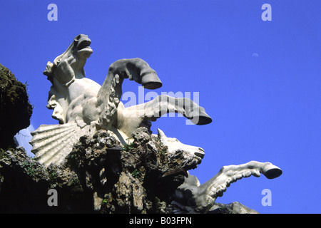 Two white winged horses rearing, isolated against a blue sky, carving detail Parc de la Ciutadella fountain, Barcelona, Spain Stock Photo