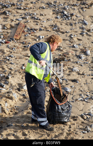 Rubbish collection Litter collecting on the beach in Cromer, Norfolk England UK Stock Photo