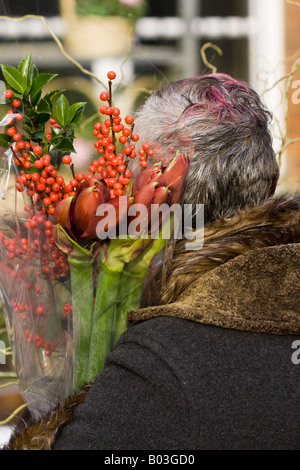 Woman in Columbia Road Flower Market, London Stock Photo