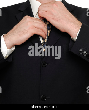 Businessman Adjusting His Tie Close Up Stock Photo