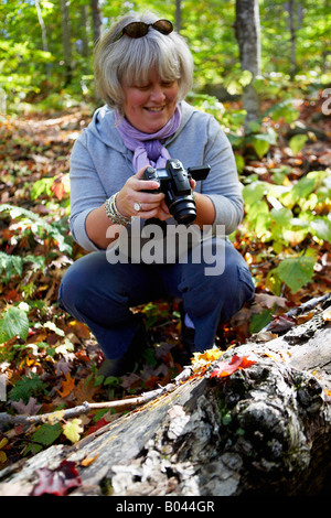 Woman Filming in Forest Stock Photo