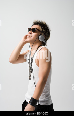 Japanese man listening to music Stock Photo