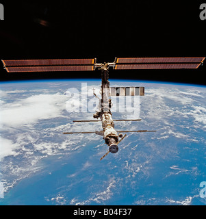 Mir Space Station floating above the Earth Stock Photo