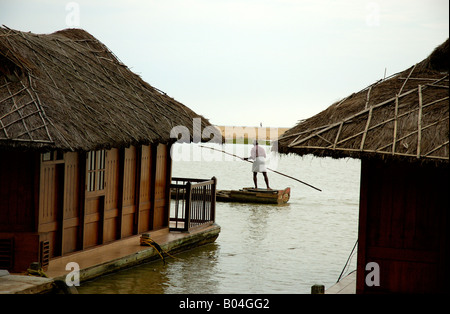 Boat paddles past at Poovar Island Resort Trivandrum Thiruvananthapuram Kerala India Stock Photo