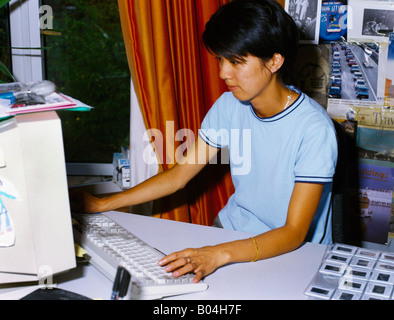 Chinese Woman On Computer Stock Photo