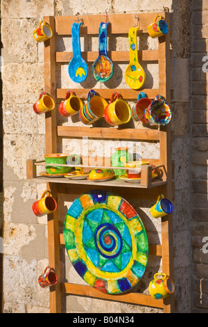 Colourful pottery on display outside a shop in the old historic town centre of San Gimignano, a UNESCO World Heritage Site Stock Photo
