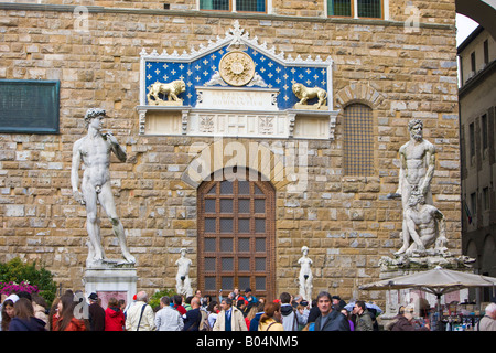Entrance to Palazzo Vecchio with Republican frieze above, guarded by statues including that of David, Piazza della Signoria Stock Photo