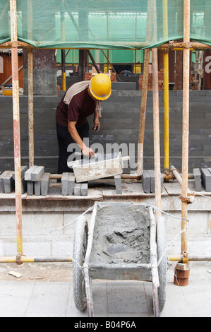 Man Building Wall On Construction Site, Xian, China Stock Photo