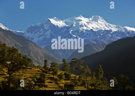 Sunset on MANASLU PEAK 8163 meters as seen from near Jagat in the ANNAPURNA CIRCUIT NEPAL Stock Photo