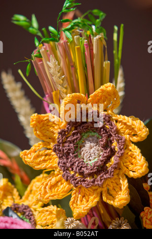 Crocheted flower arrangements on display at the markets in Piazza Galletti in the historic old town centre of Pienza Stock Photo