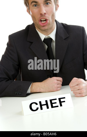 chief at desktop, with clenched fists Stock Photo