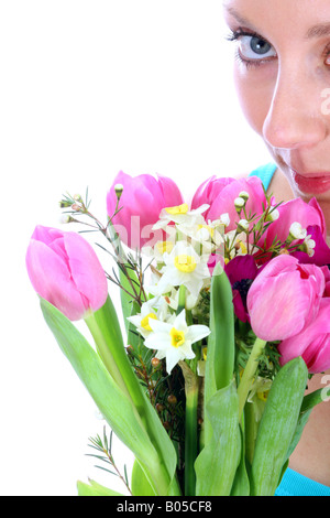 Young Woman Holding A Gift Of A Bouquet Of Beautiful Mixed Cut Flowers Isolated Against A White Background With A Clipping Path Stock Photo