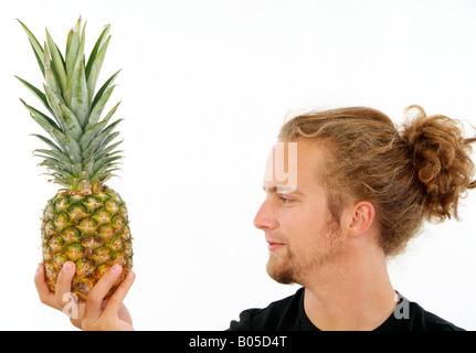 young man with pineapple Stock Photo