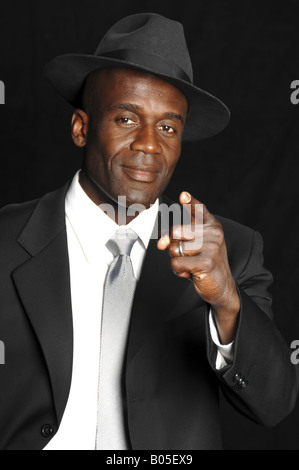 A mid adult African American businessman in a white shirt, tie pointing his finger at the viewer Stock Photo