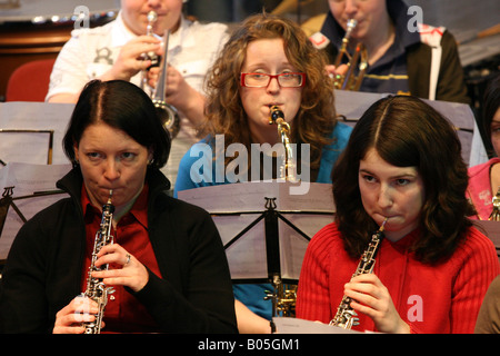 Young musicians play oboe, saxophone and trumpet Stock Photo