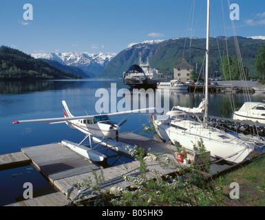 Seaplane, yacht and ferry moored on Ulvikfjord, an arm of Hardangerfjord, Ulvik, Hordaland, Norway. Stock Photo