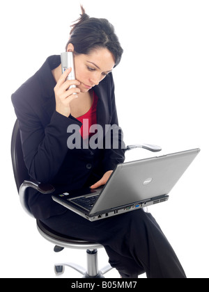 Young Woman Using Telephone and Laptop Model Released Stock Photo