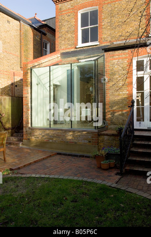 small glass extension to Victorian terraced brick house by 3S Architects Stock Photo