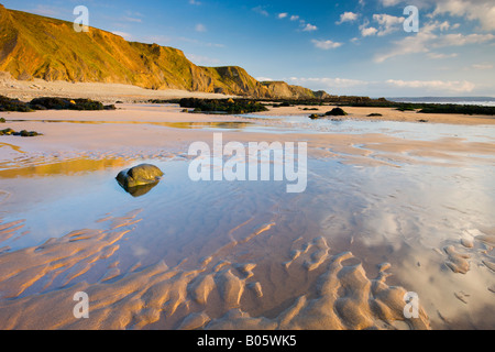 Sand pools and cliffs at Sandymouth Bay in North Cornwall England Stock Photo