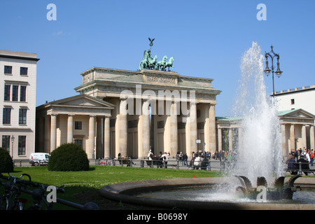 Fountain and visitors at Brandenburger Tor gate Berlin, Germany Stock Photo