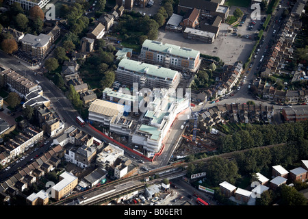 Aerial view south east of Queens Road train station railway line suburban houses shops Peckham London SE15 England UK Stock Photo