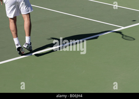 Shadow thrown by Albert Costa as he serves during the final of the Tenerife Senior cup at Abama Stock Photo