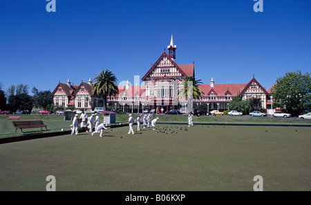 Lawn bowlers enjoy a beautiful day at the local lawn bowling club in Rotorua, New Zealand. Stock Photo