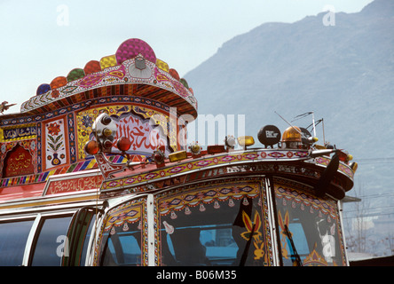 Pakistan Swat Valley Mingora top of decorated bus amongst mountains Stock Photo