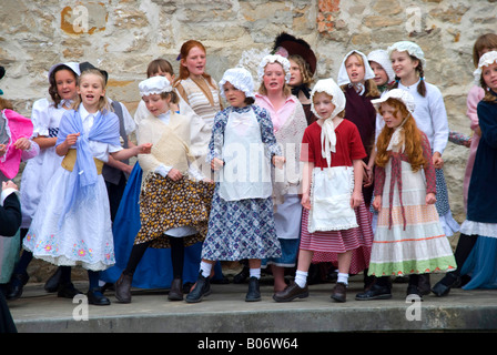 Primary school children s choir wearing period costume perform at an event in the old women s prison known as the Female Factory Stock Photo