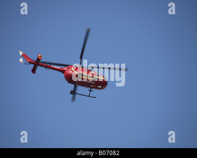 Devon Air Ambulance in a clear blue sky Stock Photo